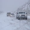 Motorist make their way back down Mount Charleston slowly as slick roads and minimal visibility make it difficult to drive safely. At about 5,000 feet, the snow got heavier and made driving difficult for non-SUVs.