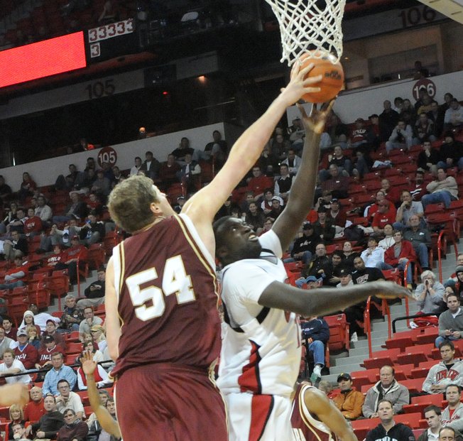 Brice Massamba gets blocked by John Bryant of Santa Clara Wednesday night as UNLV takes on Santa Clara. UNLV won 78-66.