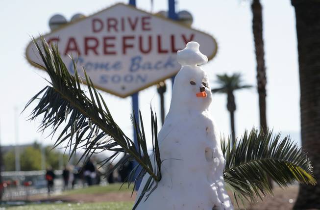 A snowman was left standing Thursday afternoon at the "Welcome to Fabulous Las Vegas" sign on the Las Vegas Strip. Most of the snow along the Strip had melted as temperatures climbed into the 40s a day after snow blanketed the valley. 