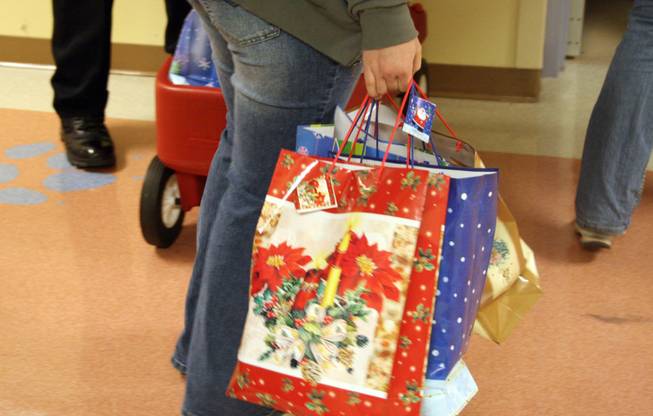 Gift bags full of dancing Santas and patrol cruiser replicas went to children in the intensive care units of two hospitals Wednesday.