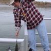 Trish Hayes checks her days catch at the Boulder Harbor dock in this file photo from December. Natural causes have made it difficult for the Nevada Department of Wildlife to keep the lake stocked with fish in 2009.
