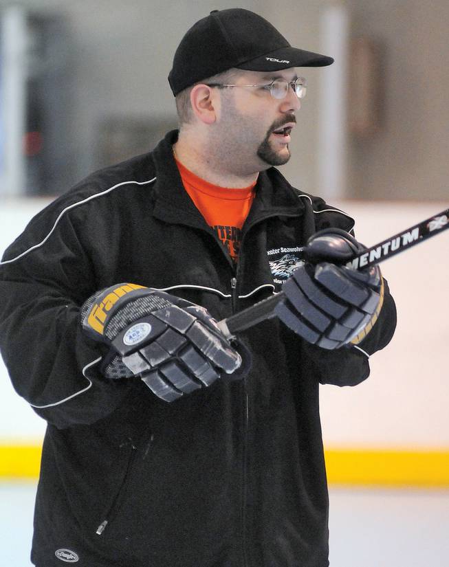 Adam Stio, head coach of the Las Vegas Aces, a new professional roller hockey team sanctioned by the American Inline Hockey League, shouts instructions to his players during a team practice at the Las Vegas Roller Hockey Center.