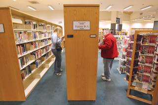 Readers browse the books at the Green Valley Library on Dec. 18. The library, currently part of the Las Vegas-Clark County Library District, will close its doors on Dec. 23 and be turned over to the Henderson Library District, which plans to remodel it.