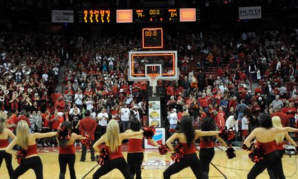 The Rebel Girls cheer at the end of the game Saturday after the team defeated the Arizona Wildcats 79-64.