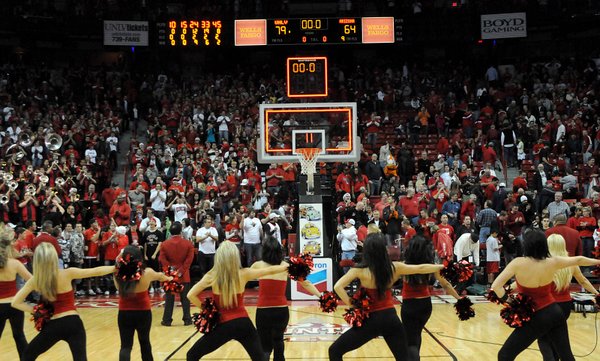 The Rebel Girls cheer at the end of the game ...