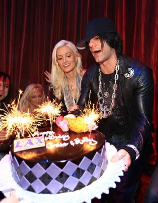 Criss Angel and Holly Madison were surprised with a big birthday cake at their joint birthday bash at LAX on Dec. 19. 