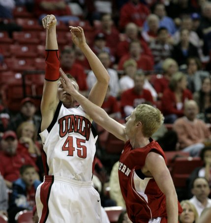Joe Darger hits a three with a hand in the face Tuesday at the Thomas & Mack, where UNLV took on Southern Utah.  UNLV defeated SUU 73-60.