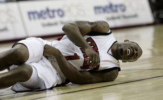 Wink Adams falls to the floor in pain with an abdominal injury Dec. 23 at the Thomas & Mack, where UNLV took on Southern Utah.  UNLV defeated SUU 73-60.