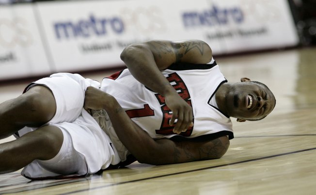 Wink Adams falls to the floor in pain with an abdominal injury Dec. 23 at the Thomas & Mack, where UNLV took on Southern Utah.  UNLV defeated SUU 73-60.