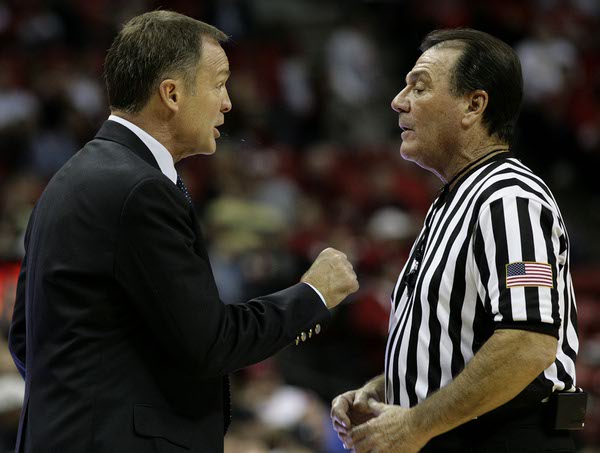 UNLV head coach Lon Kruger argues with the referee about ...