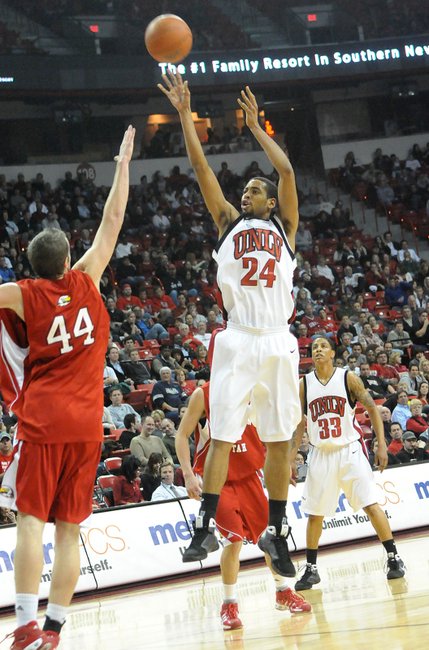 Rene Rougeau hits a mid-range jumper against John Clifford on Tuesday at the Thomas & Mack Center, where UNLV took on Southern Utah.
