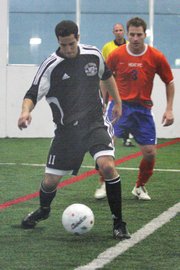 Las Vegas Knights forward Itzik Rapaport keeps the ball away from the Arizona Heat defender during the season home opener at the Las Vegas Sports Park on Dec. 13.