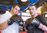 MMA fighters Danny (left) and Marco Scoalri pose for a portrait during their training session at the Las Vegas Athletic Club in Las Vegas.