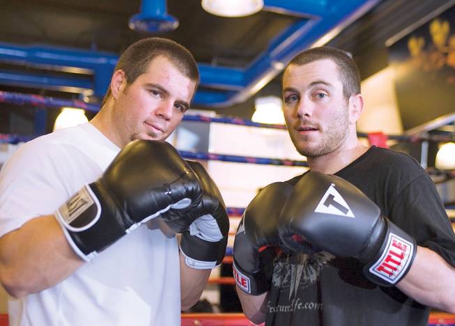 MMA fighters Danny (left) and Marco Scoalri pose for a portrait during their training session at the Las Vegas Athletic Club in Las Vegas.
