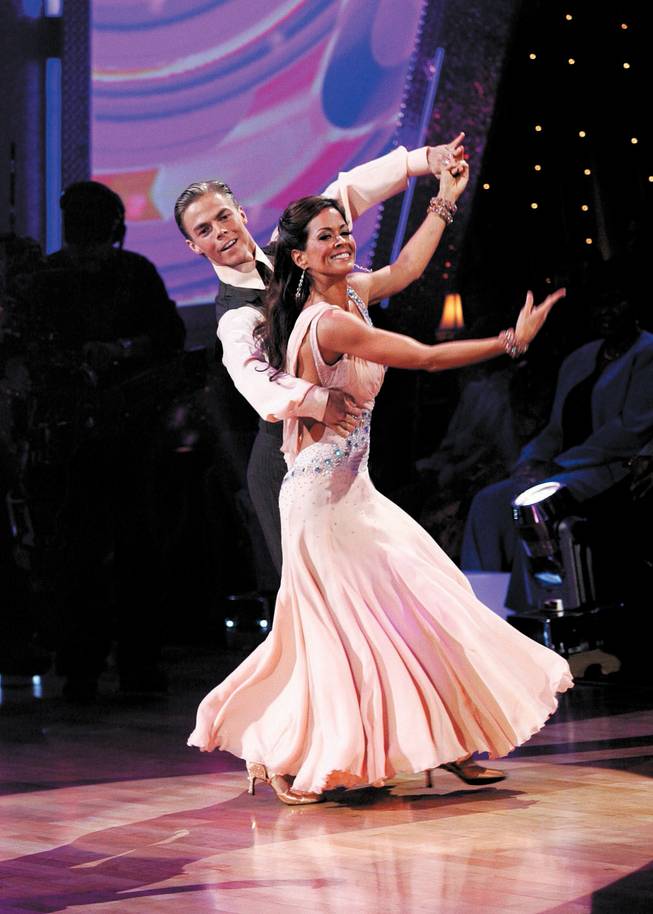 TV personality Brooke Burke dances Season 7's finale of <em>Dancing With the Stars</em> with partner Derek Hough. The couple won the mirror-ball trophy.