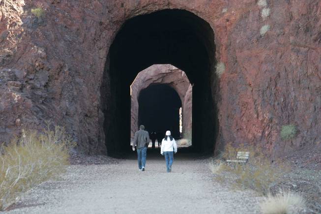 A small group of hikers walk through the tunnels at the Historic Railroad Trail at Lake Mead on Saturday, Dec. 27, 2008. The route to the Hoover Dam was a government-owned trail used for carting materials to build the historic landmark 24 hours a day.