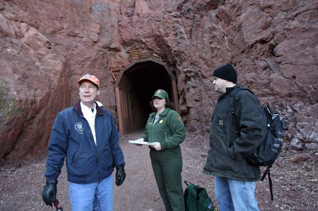 National Park Services educator Sky McClain, center, talks with Richard Williamson, left, and Russell Witt during a guided hike at the Historic Railroad Trail at Lake Mead on Saturday, Dec. 27, 2008.
