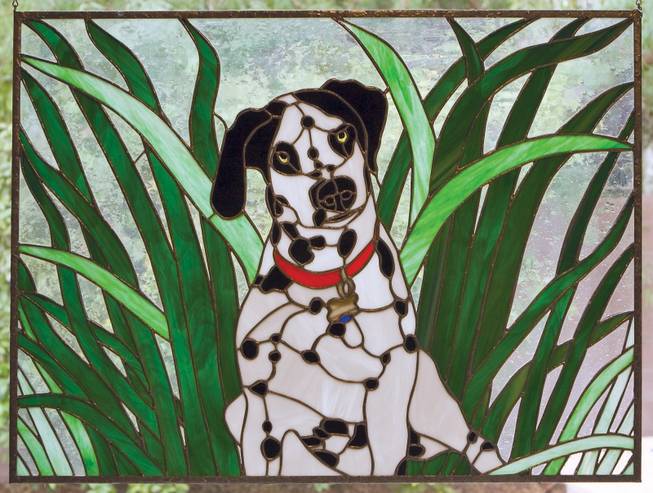 "Orbit," a stained glass piece by Christine Curtis Wilson based on her dog, will be exhibited at the Summerlin Library.