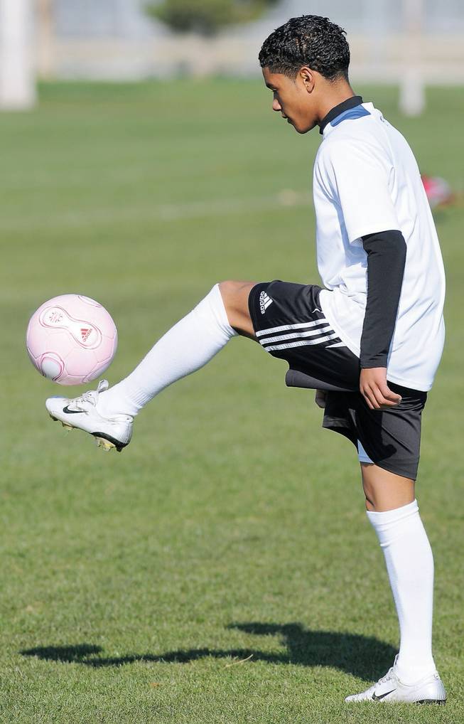 Antonio Velazquez, 13, dribbles a ball in the air while warming up for the Nevada State Olympic Development tryouts at the Bettye Wilson Soccer Complex.
