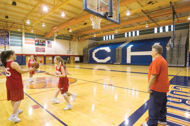 Coronado girls' basketball coach Bill Crego watches over practice.