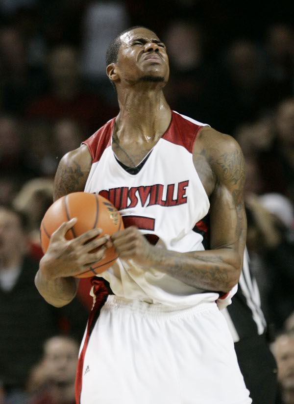 Louisville's Earl Clark grimaces late in the second half against ...