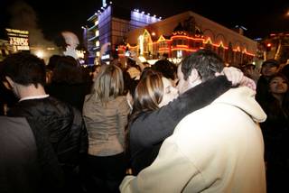 A couple brings the new year in with a kiss on the Las Vegas Strip. 