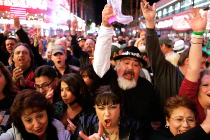 Fans cheer as The Original Kiss Army plays during Tribute Palooza, the New Year's Eve party at the Fremont Street Experience in downtown Las Vegas.