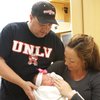 Jeffrey and Jennifer Judd hold newborn Khloe Noelle Judd, 7 pounds, 2 ounces, who was the first baby born in Henderson in 2009. Khloe was born at 2:35 a.m. at St. Rose Dominican Hospital - Siena Campus.
