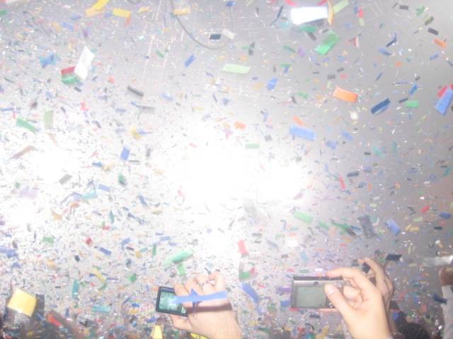 Midnight: Confetti drops, music blares and people dance and celebrate as they ring in 2009 at Rain.
