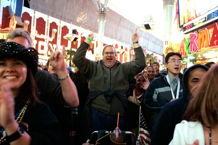 The crowd cheers for 2U, a U2 tribute band, during Tribute Palooza, the New Year's Eve party at the Fremont Street Experience in downtown Las Vegas Wednesday. 
