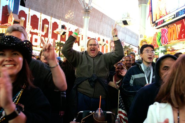 The crowd cheers for 2U, a U2 tribute band, during ...