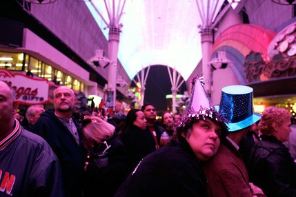 Sandra Burlason of Las Vegas watches the light show during Tribute Palooza, the New Year's Eve party at the Fremont Street Experience in downtown Las Vegas Wednesday. 