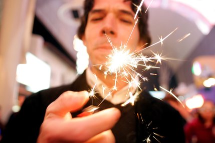 Adonis Cardero-Rosas lights up a sparkler during Tribute Palooza, the New Year's Eve party at the Fremont Street Experience in downtown Las Vegas Wednesday. 