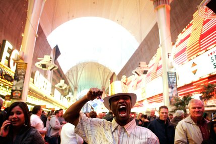 Matthew Ingelwood of Las Vegas cheers during Tribute Palooza, the New Year's Eve party at the Fremont Street Experience in downtown Las Vegas Thursday.