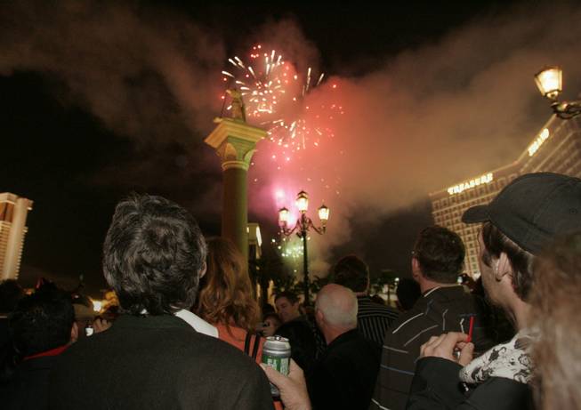 Visitors on the Strip watch fireworks while ringing in 2009 at the Venetian. 