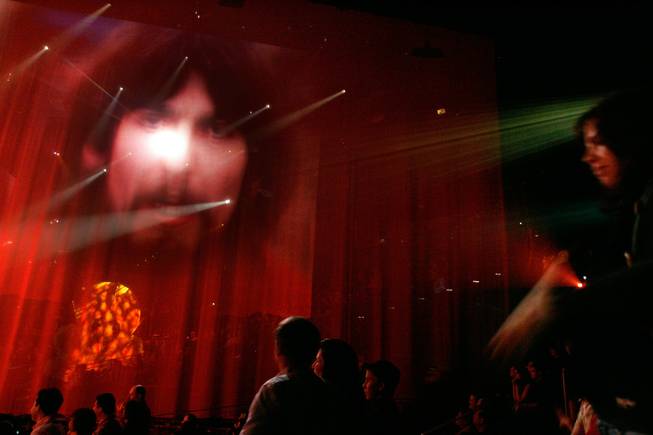Images of the Beatles are projected on screens at the end of Cirque Du Soleil's Love at the Mirage Friday, Dec. 19, 2008. 