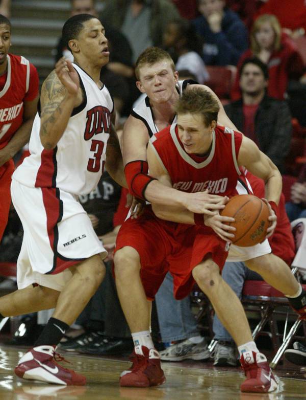 UNLV guard Tre'Von Willis, left, and forward Joe Darger pressure ...
