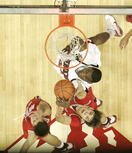 UNLV forward Darris Santee grabs a rebound away from New Mexico forward Daniel Faris during the second half of their Mountain West Conference opener at the Thomas & Mack Center.