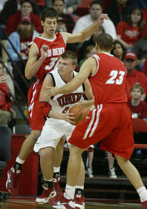 UNLV forward Joe Darger gets double-teamed by New Mexico forward ...