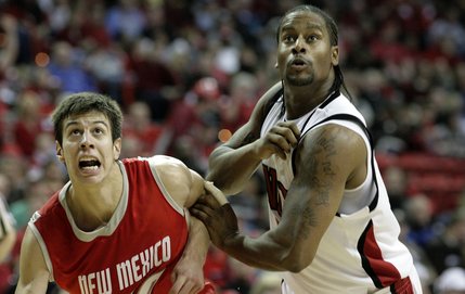 Mo Rutledge and New Mexico's Roman Martinez battle for position Saturday at the Thomas & Mack Center as UNLV took on New Mexico.  