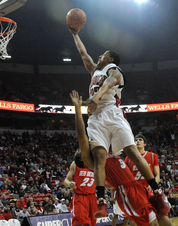 Tre'Von Willis lays it in over Dairese Gary on Saturday ...