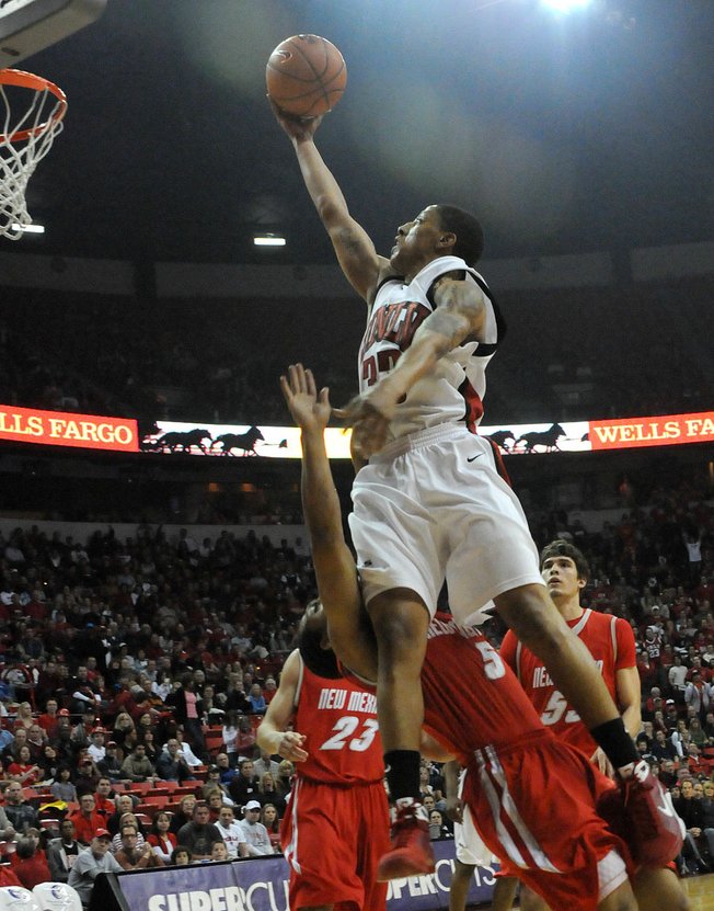 Tre'Von Willis lays it in over Dairese Gary on Saturday at the Thomas & Mack Center as UNLV took on New Mexico. 