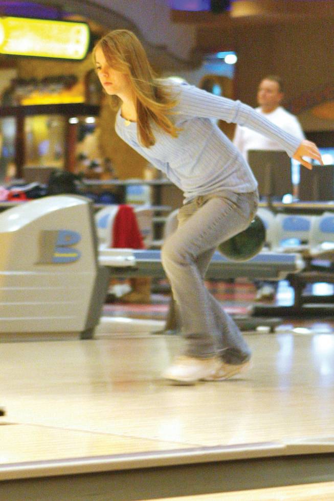 Basic High bowler Suzanna Padderatz bowls during practice at Sunset Station Strike Zone bowling lanes.