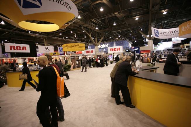 Show-goers browse the show floor on Jan. 8, 2009, at the International Consumer Electronics Show in Las Vegas. About 120,000 to 130,000 people have attended the convention in recent years.