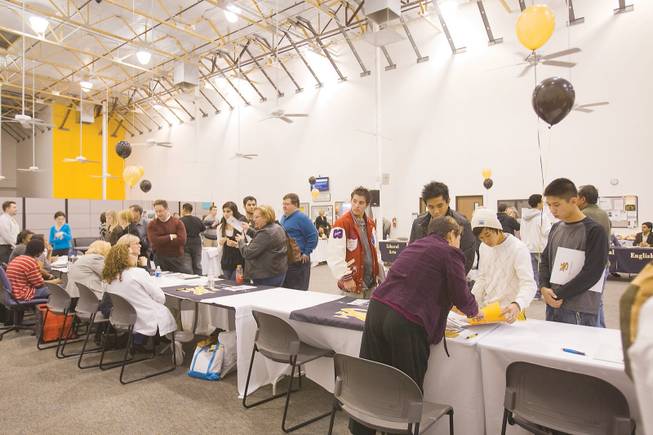 Prospective students talk with staff at Nevada State College in Henderson Jan. 8.
