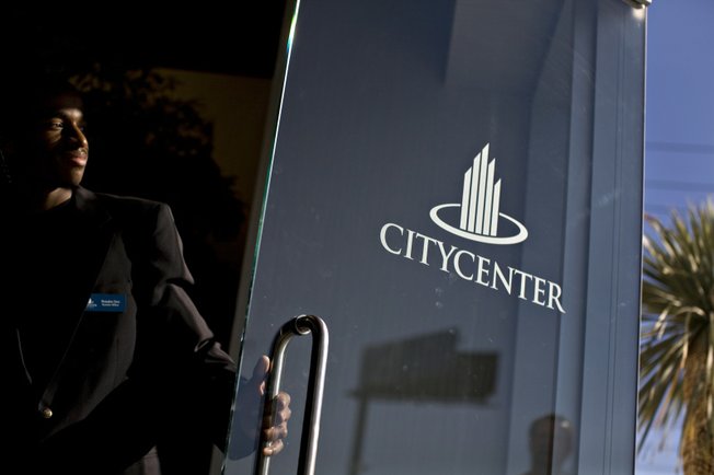 Security officer Brandon Dew greets job seekers Monday. As part of CityCenter's sales pitch to job candidates, greeters are supposed to be as enthusiastic as the applicants, to show the resort is different.
