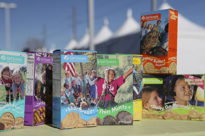 Boxes of Girl Scouts cookies sit on a table promoting the 60th cookie sale featuring the new flavor Daisy Go Rounds during the Cookie Kickoff Carnival Saturday at the Girl Scouts Frontier Council's Training and Service Center.