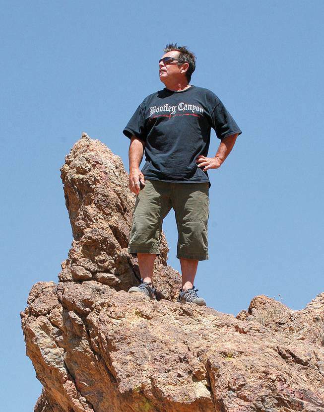 Brent Thomson stands atop the rugged terrain in Bootleg Canyon.