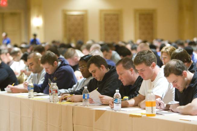 Applicants fill out the personal history questionnaire during testing for employment Tuesday at the Suncoast.