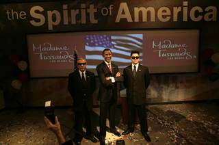 Chuck Robison, left, and D.P. Shapiro, employees at Madame Tussauds Las Vegas, pose as secret service agents with the wax figure of President-elect Barack Obama. The statue was introduced to the public Thursday as the newest addition to the wax museum.